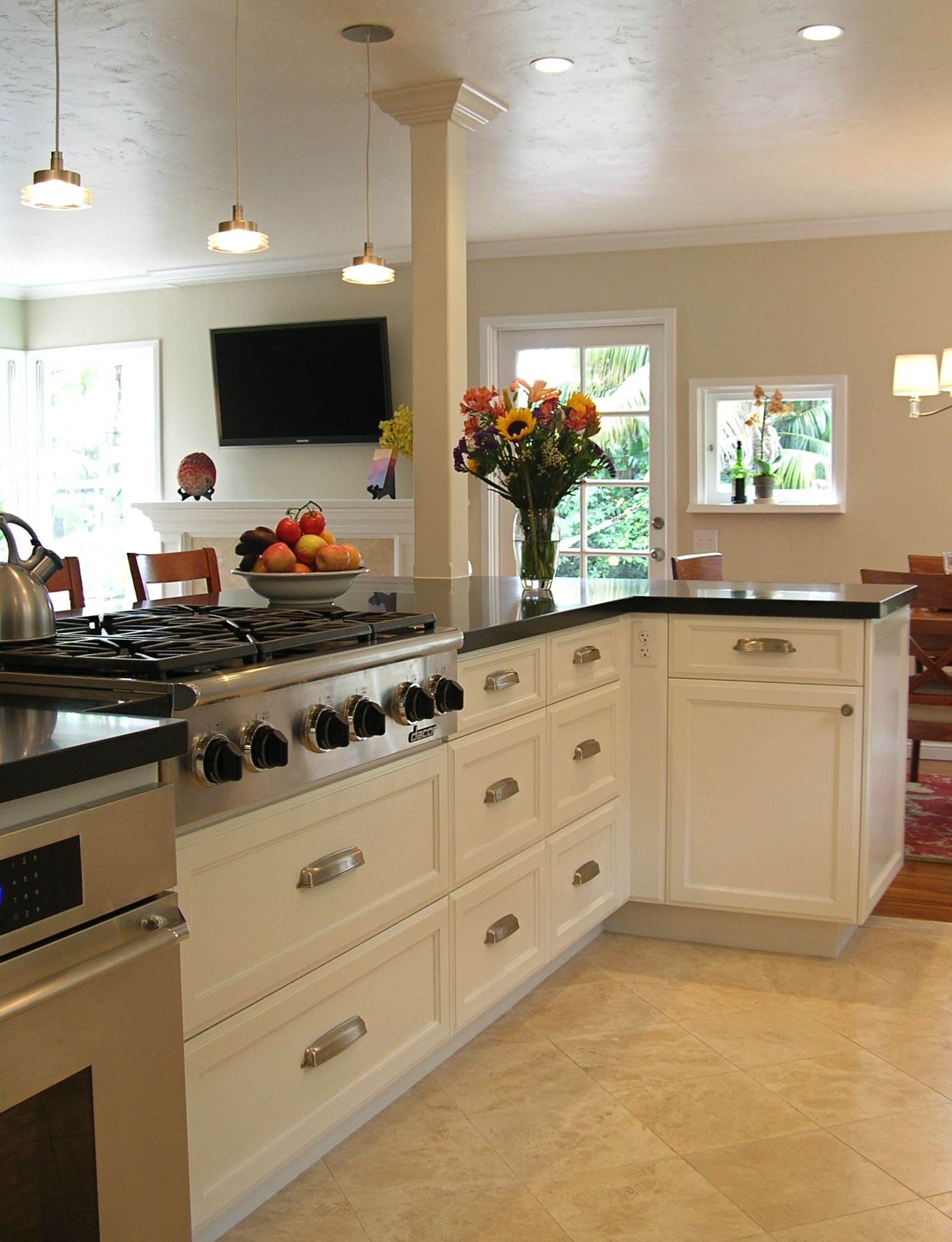 classic_cottage_kitchen_remodel_peninsula_opens_to_bright_living_room_light_3