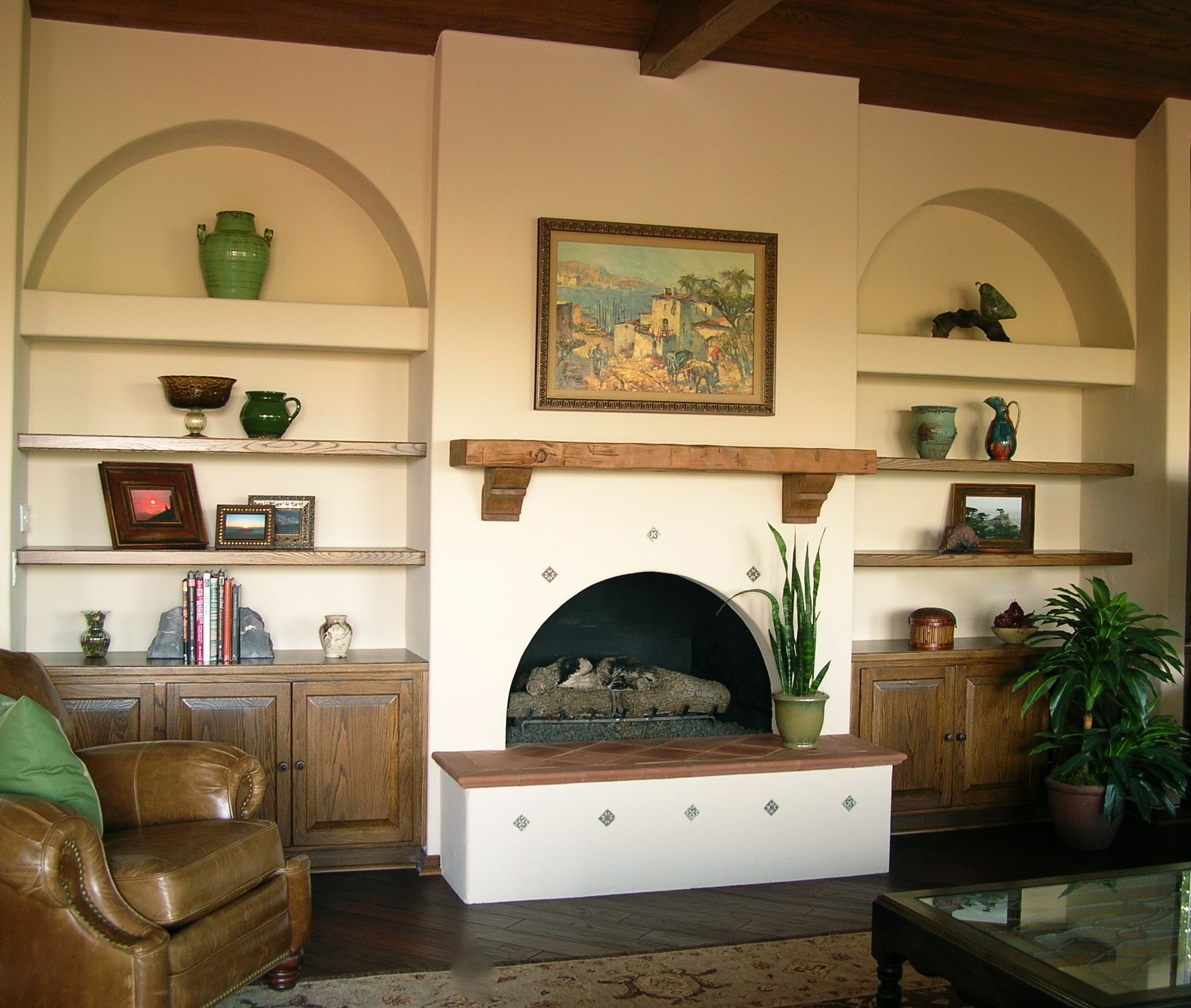remodeled_family_room_arched_bookcases_and_fireplace_with_inset_tiles_3