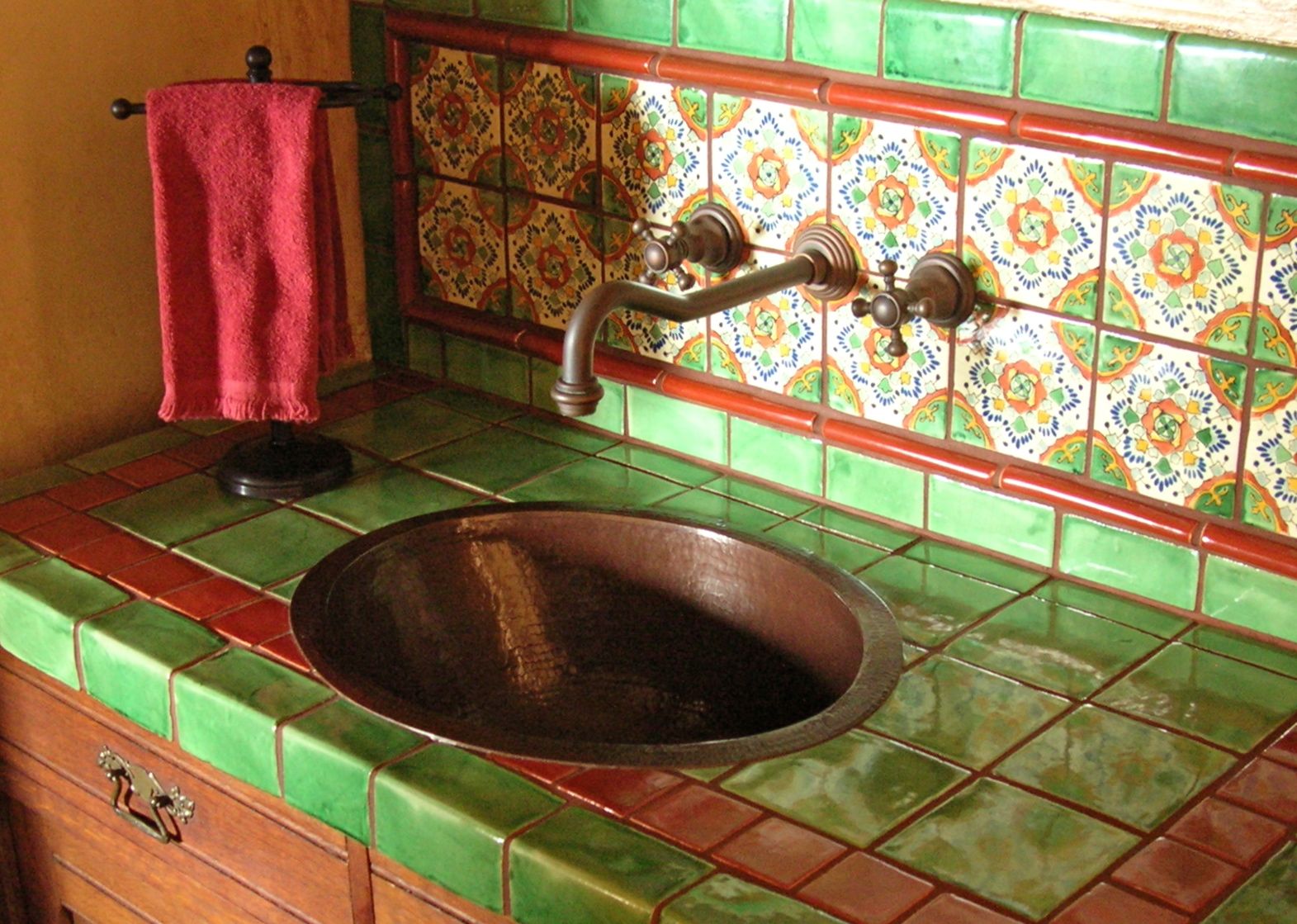 spanish_colonial_powder_room_with_antique_cabinet_and_custom_tile_design_4
